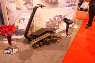 Illustration for article titled No One Looks Cool On This Goofy Tracked Snowmobile